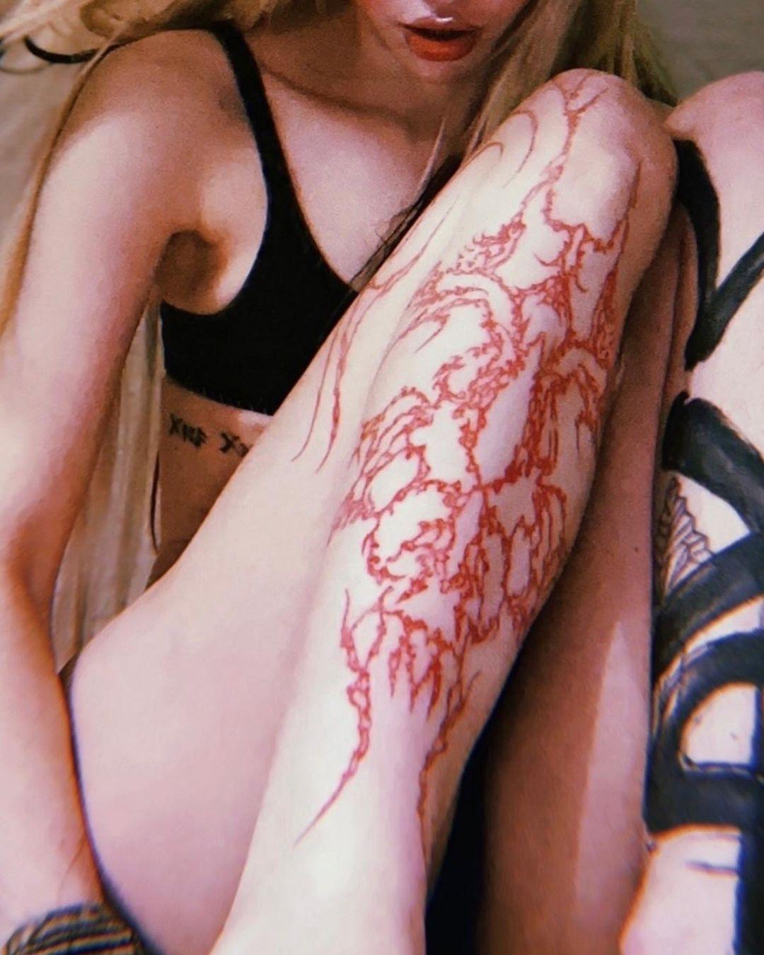 Grimes Shows Off 'Alien Scar' Tattoos As She Promotes Her New Song