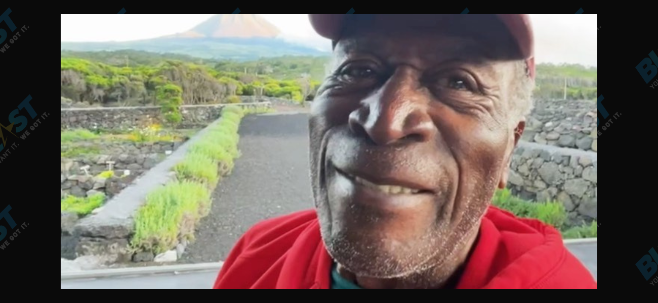 John Amos in a red jersey