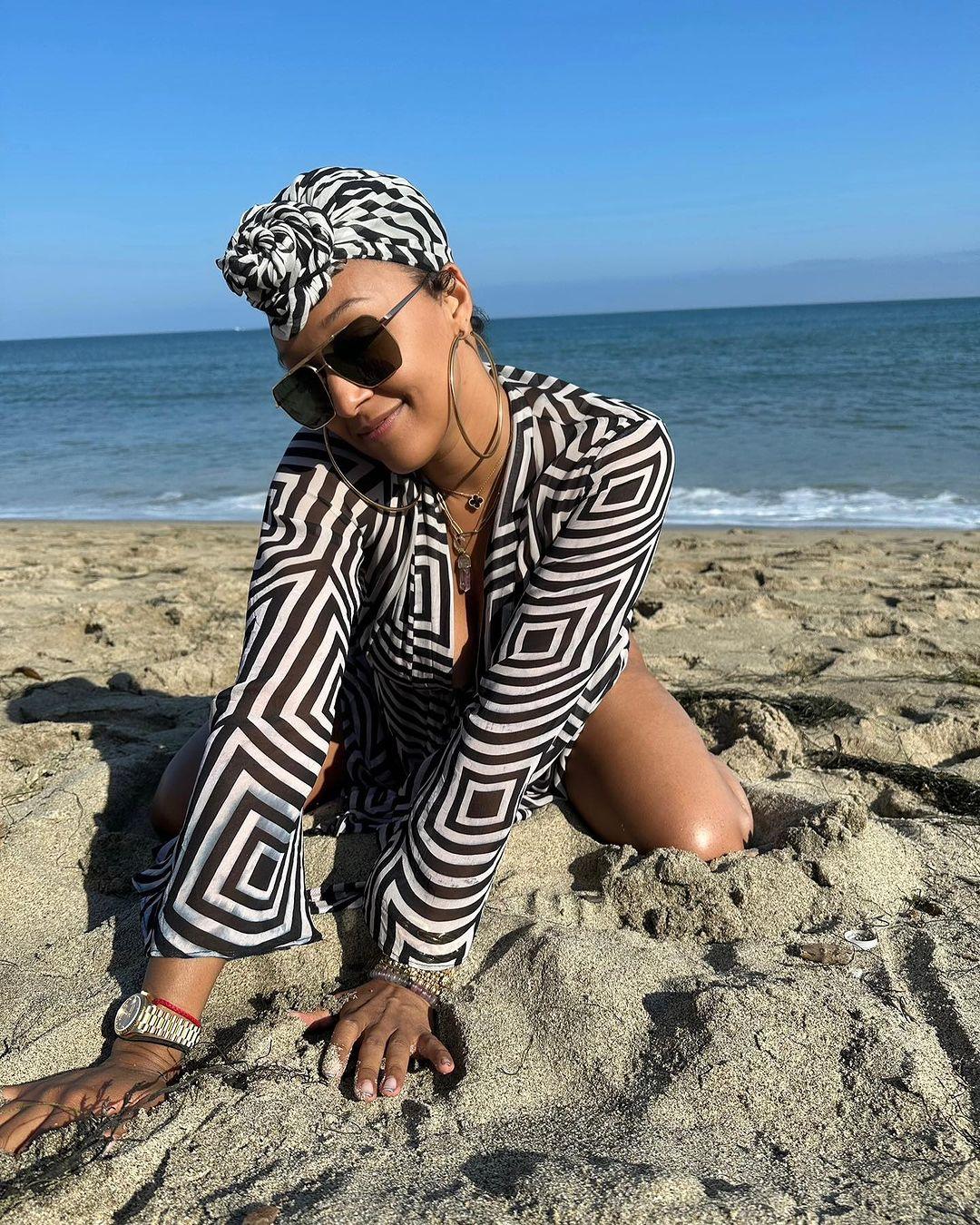 Tia Mowry puts assets on display as she enjoys beach day