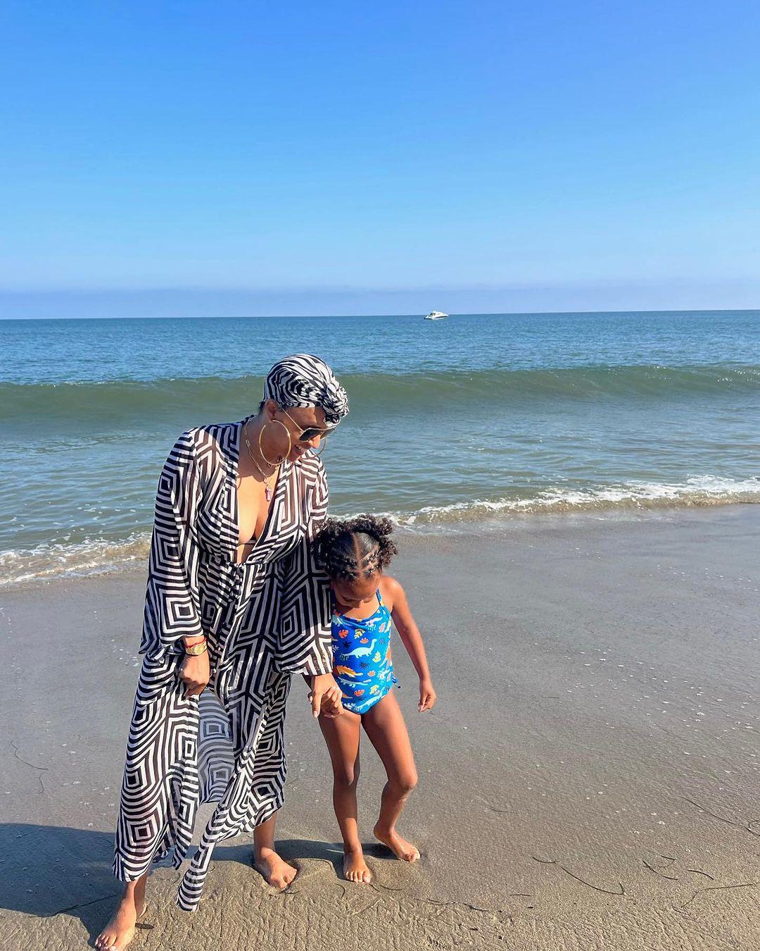 Tia Mowry puts assets on display as she enjoys beach day with daughter