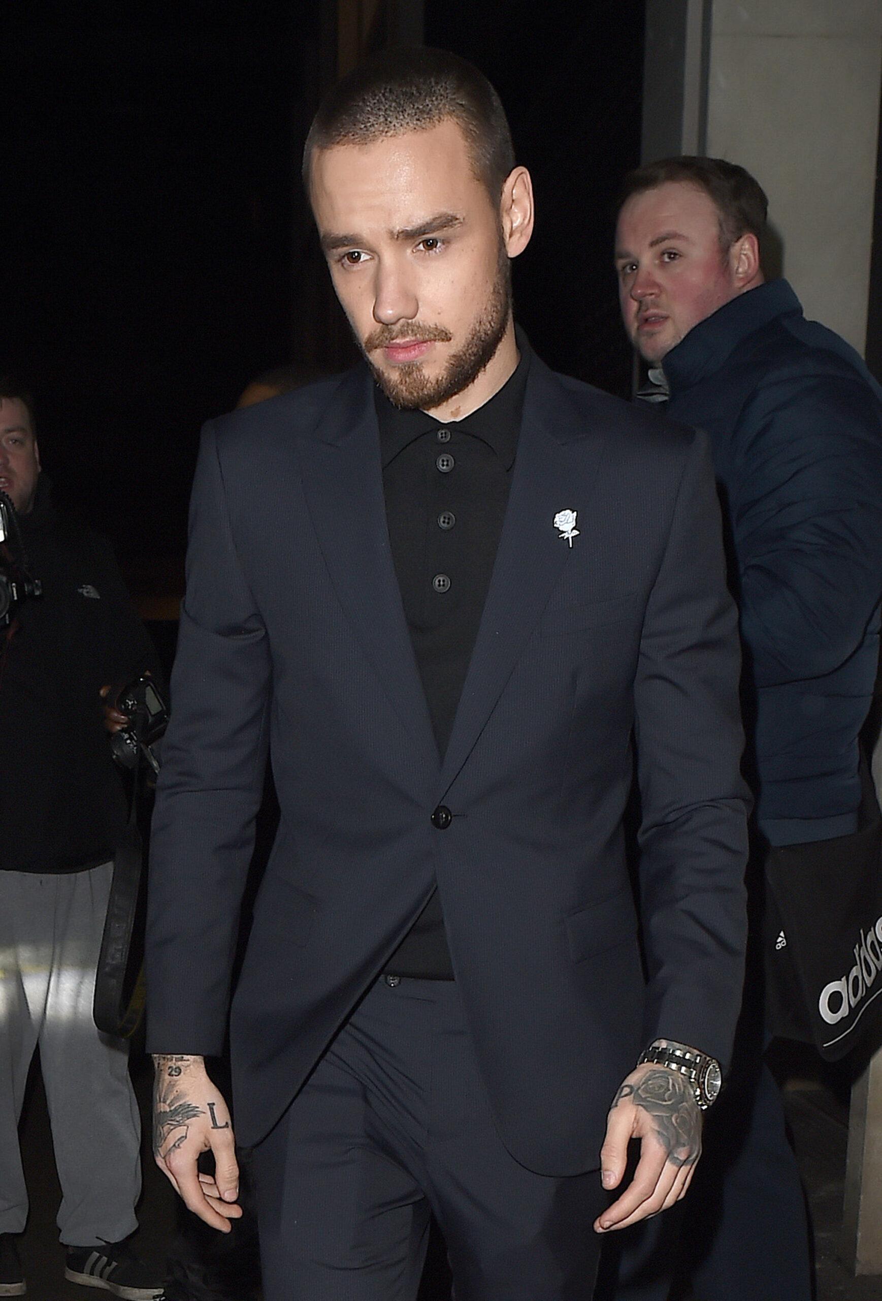 Cheryl Cole and Liam Payne display a united front as they leave the Universal Brit Awards Afterparty holding hands