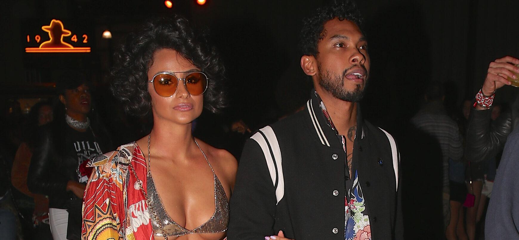 Singer Miguel and his girl at neon carnival