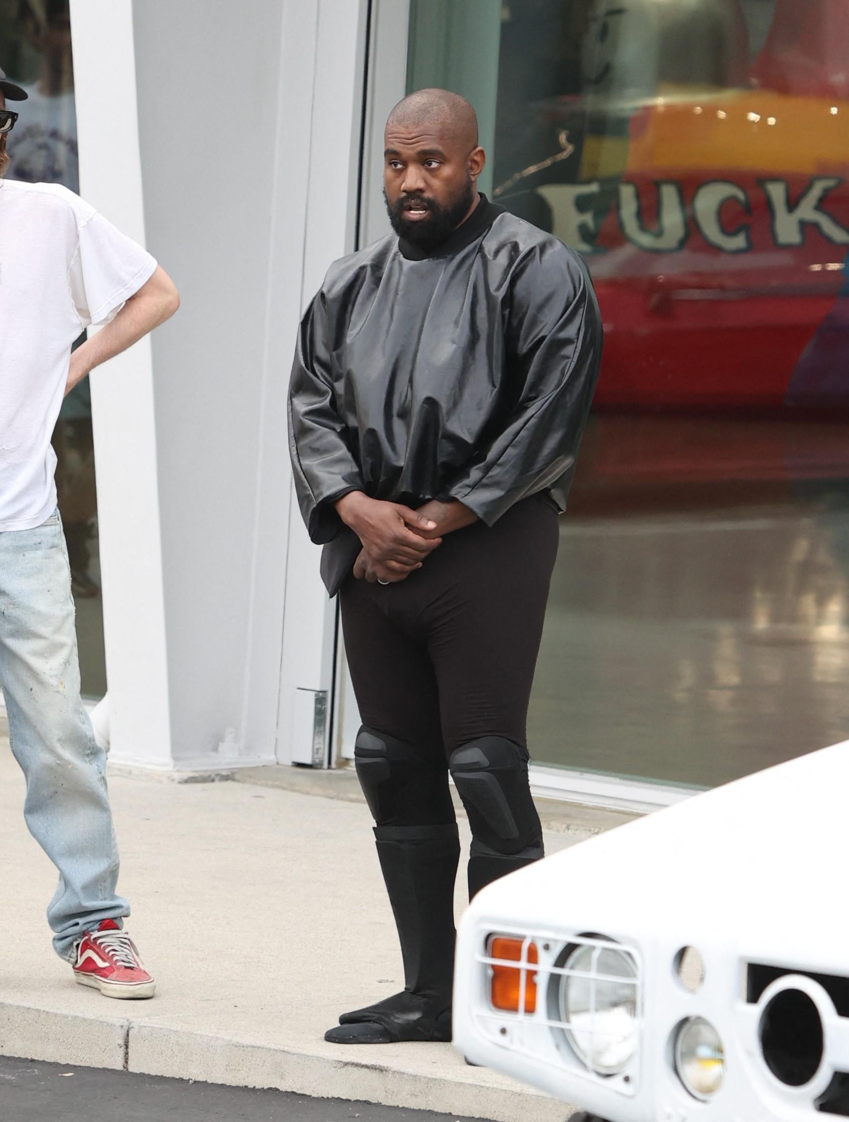 Kanye West seen in good spirits while shopping SUPREME and showing off his hummer with wife Bianca and friend