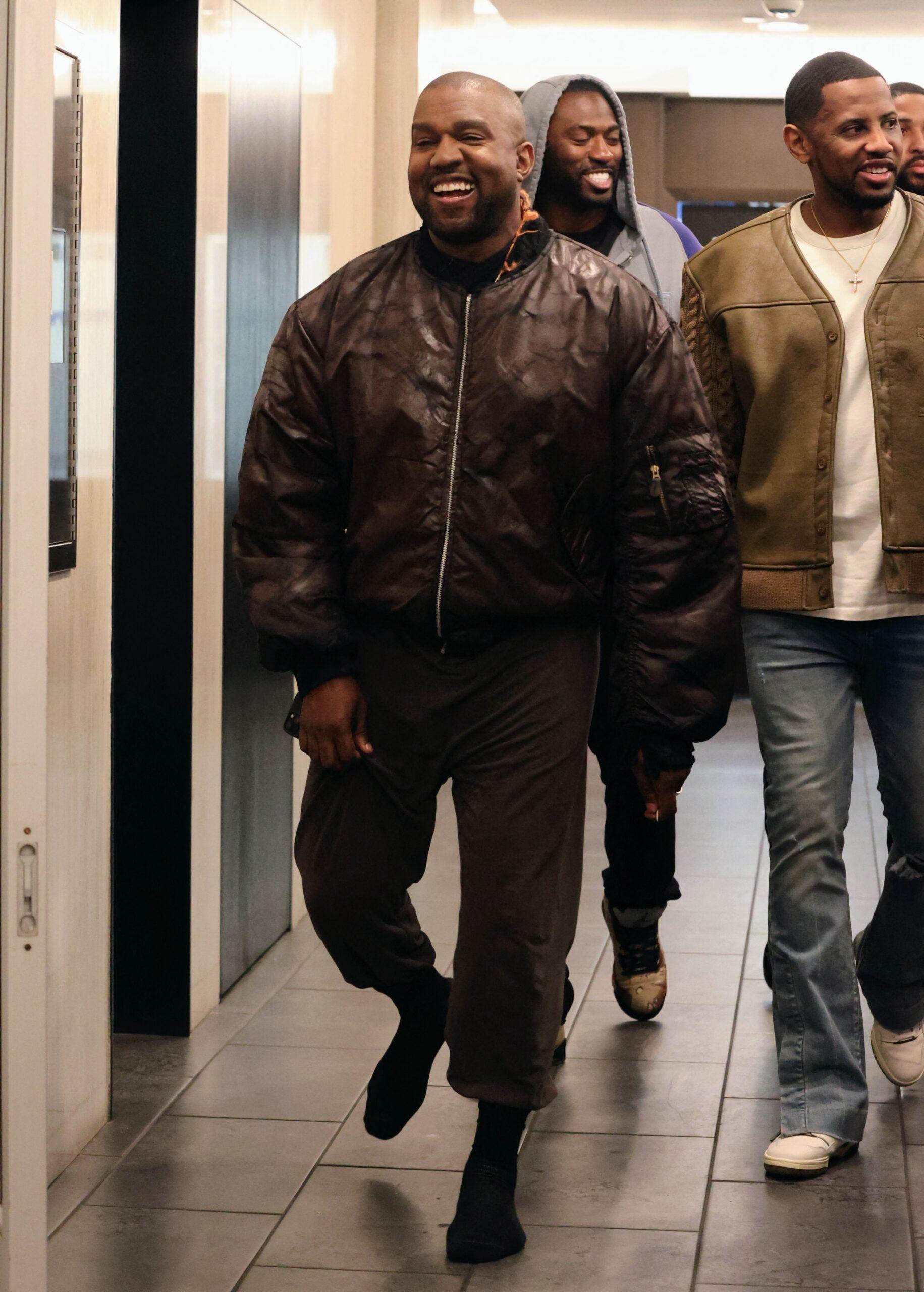 Kanye seen leaving e baldi restaurant all smiles after dining with friends