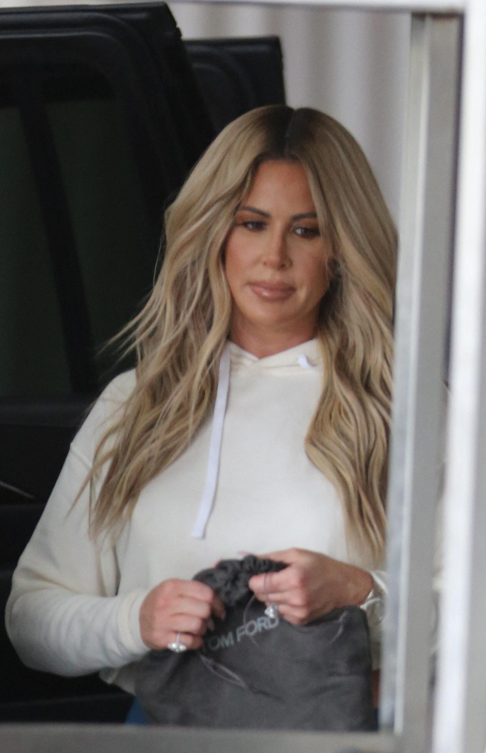 Real Housewives of Atlanta Star Kim Zolciak shows off her curves as she leaves her Miami Beach hotel