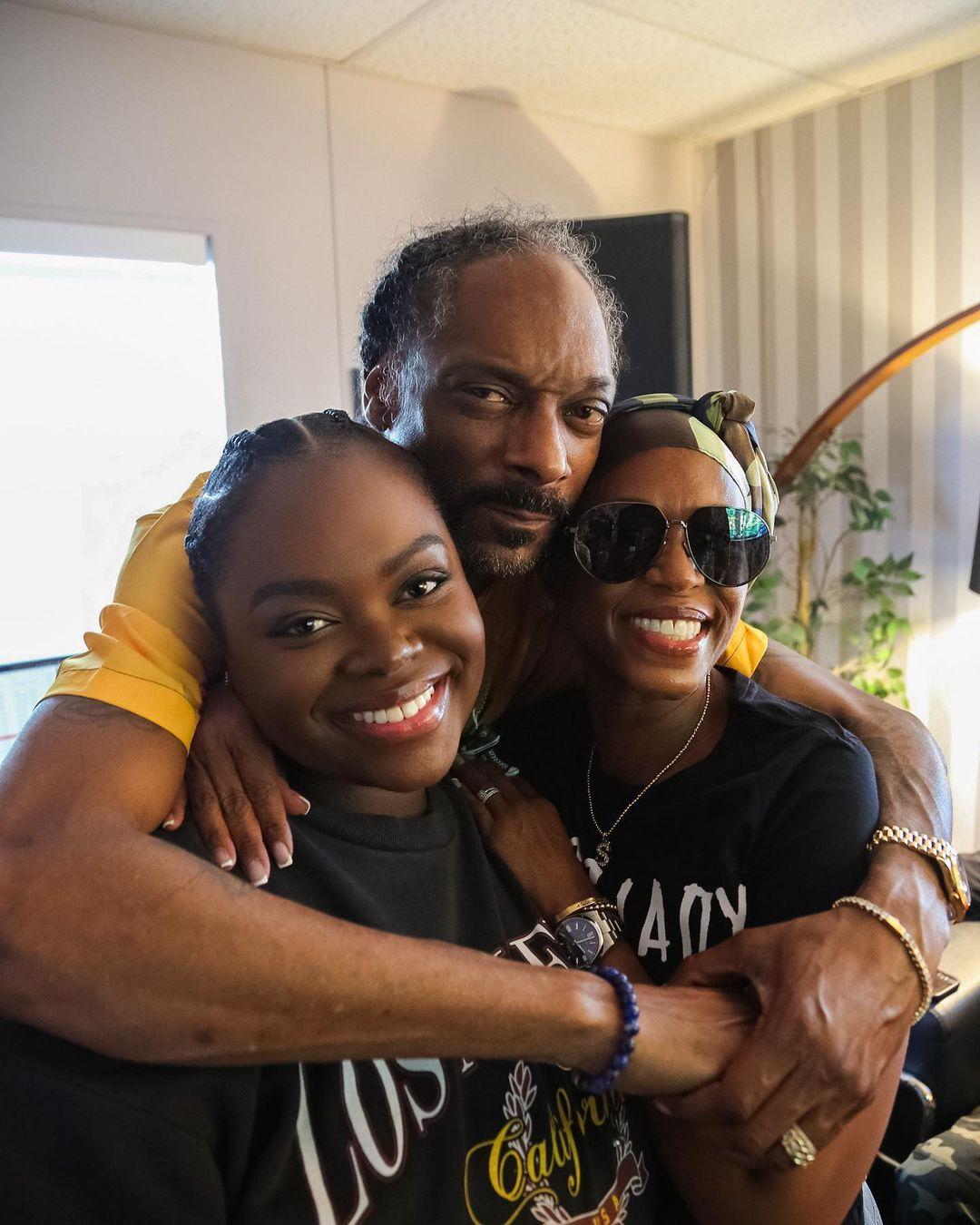 Cori Broadus Shares Rare Cuddling Snap With Dad Snoop Dogg
