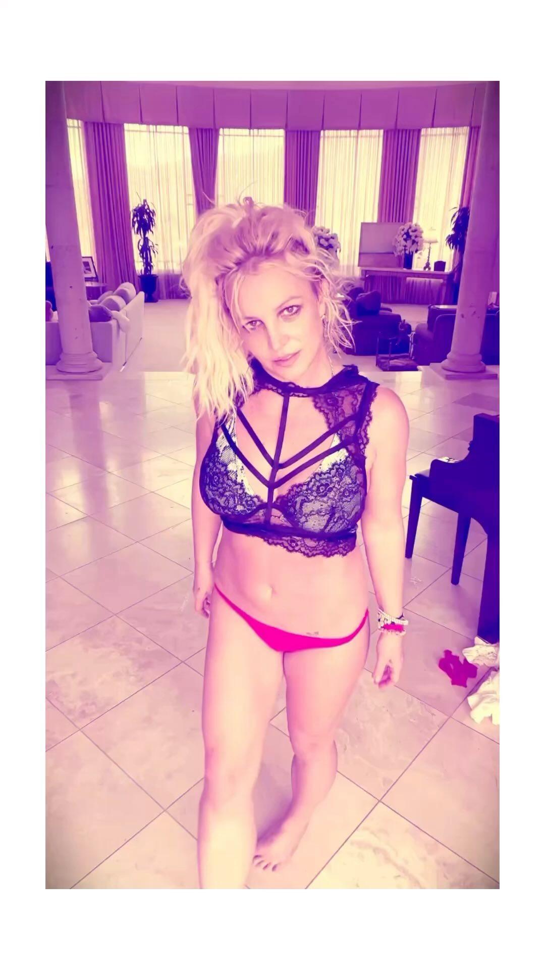 Britney Spears dances in bikini bottom and black see-through lacy bra