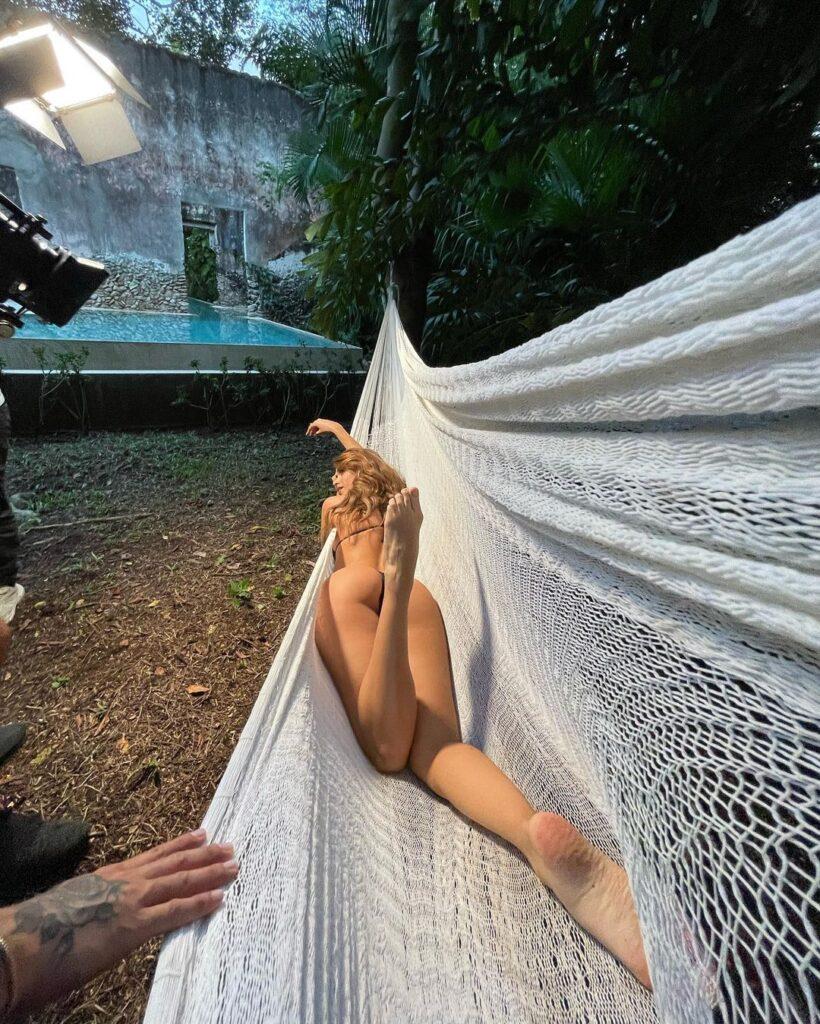 Yanet Garcia lounges on a hammock while wearing a bikini.