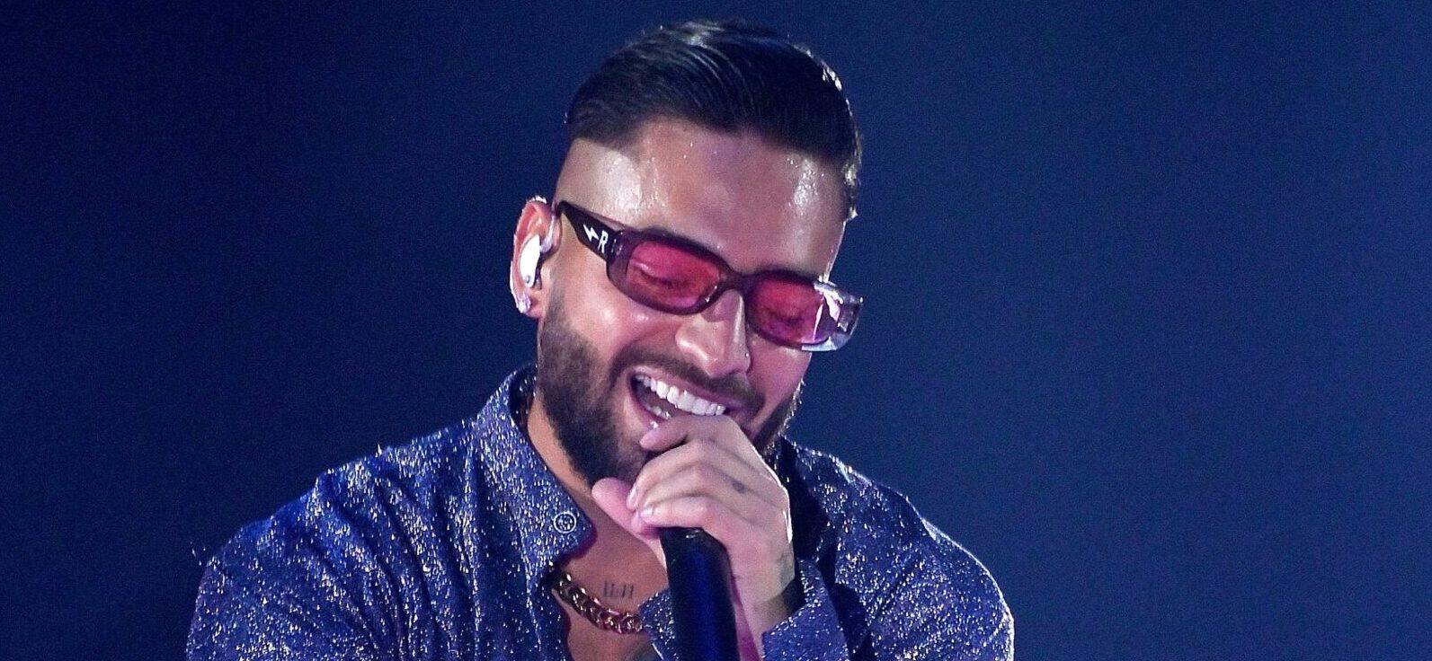 Maluma Shows Off Catching Skills After A Crutch Was Launched At Him During Concert
