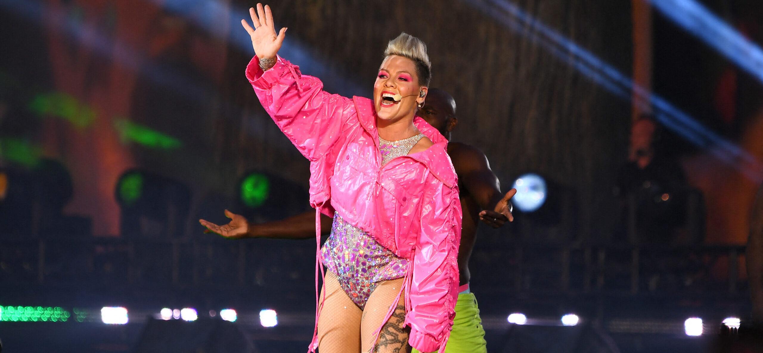 P!NK performing in London in a pink jacket