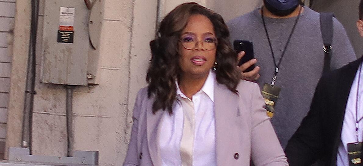Oprah Winfrey is all smiles as she waves to her fans as she leaves Cinemacon after promoting 'The Color Purple' in Las Vegas