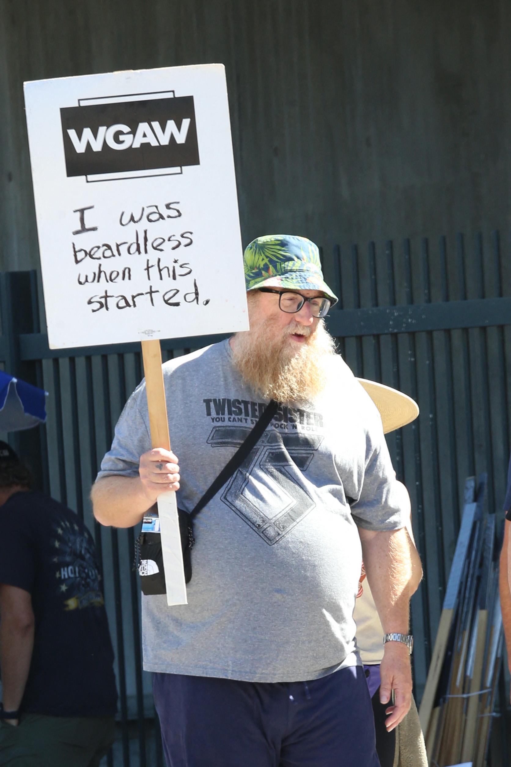 Brian Posehn is seen picketing with SAG-AFTRA and WGA members outside of CBS studios