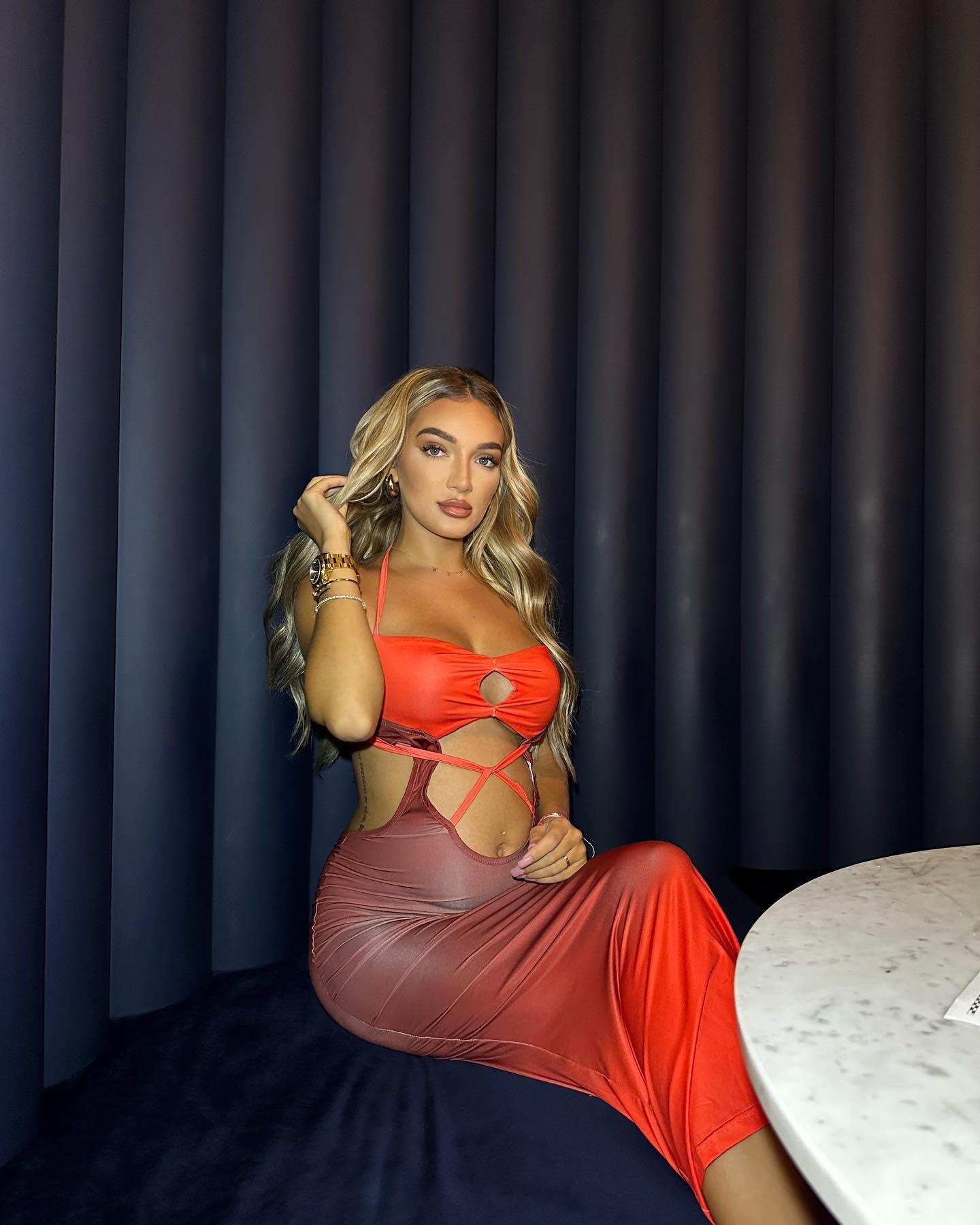 Beaux Raymond In A Strappy Red Dress Teases A 'Scarlet Night' 