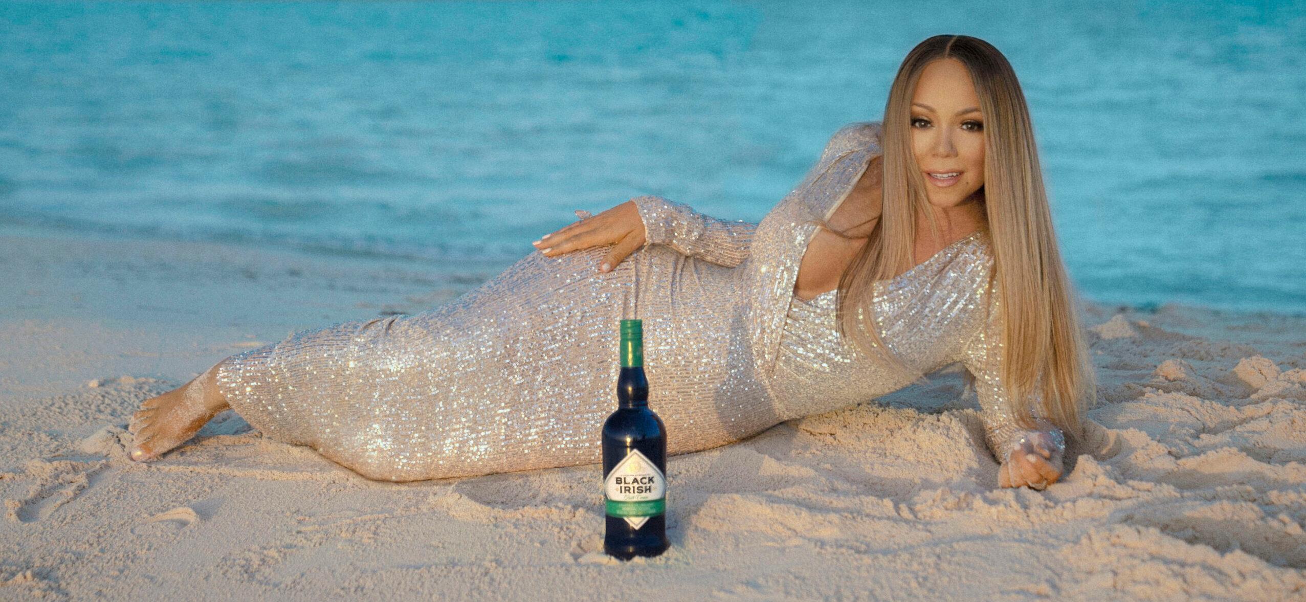 Mariah Carey looks glamorous on a beach to launch her new liqueur Black Irish