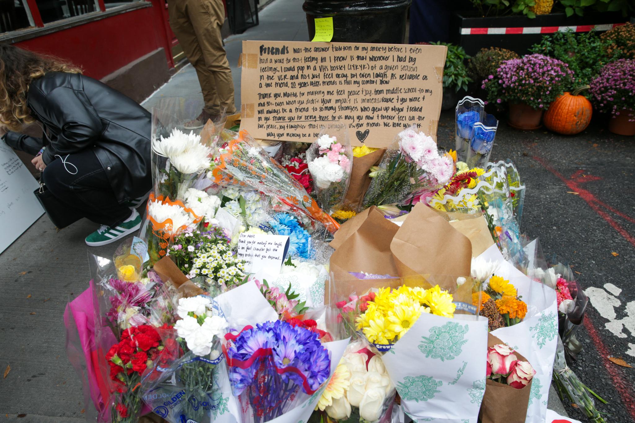 Fans Mourn Matthew Perry Outside 'Friends' Building In NYC