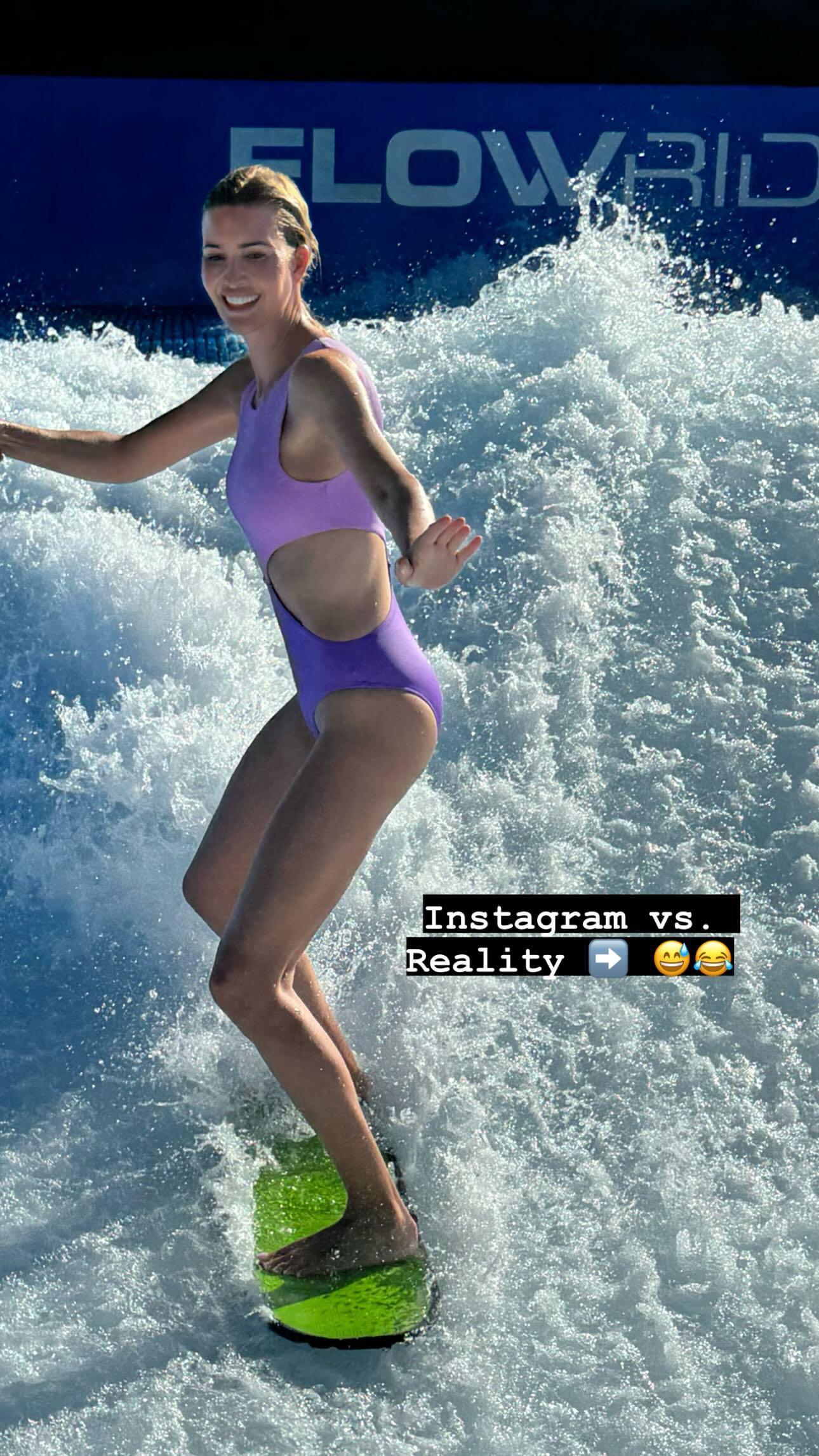 Ivanka Trump suffers a wipeout while surfing in a stunning purple swimsuit