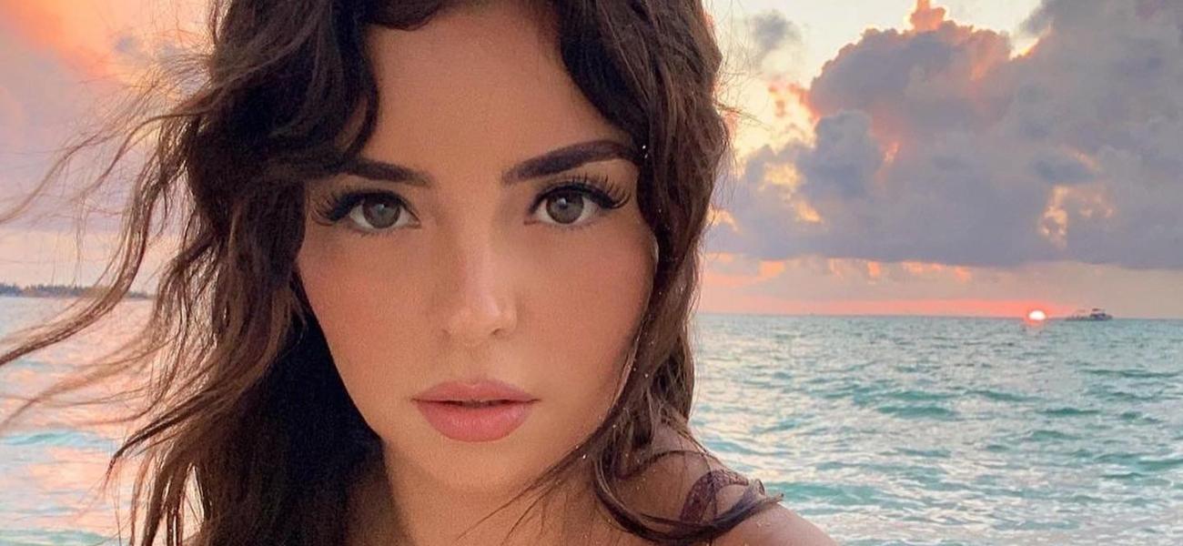 Demi Rose Sits On A Swing While Clad In Just Her Tiny White Bikini
