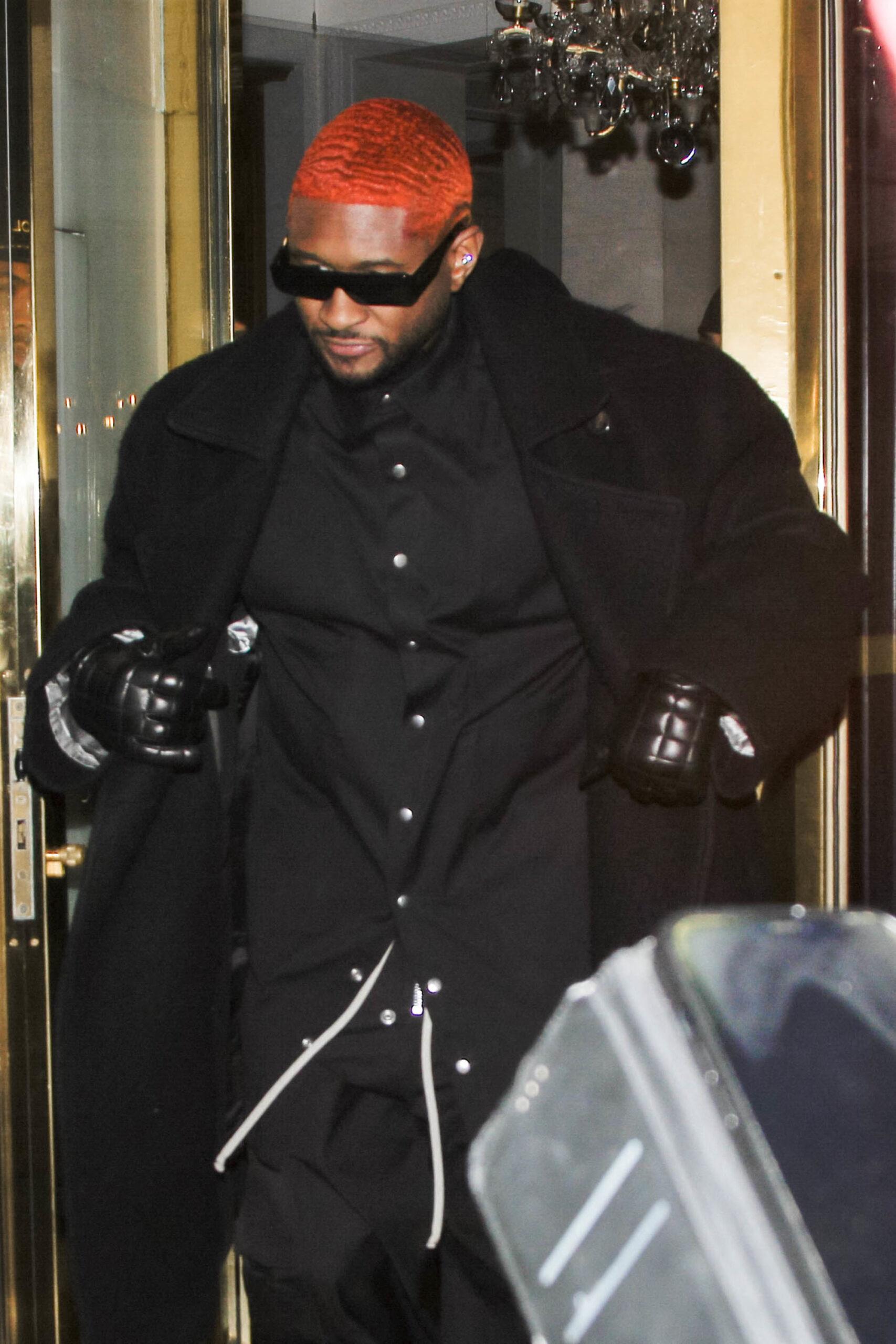 Usher is seen leaving his hotel during Paris Fashion Week