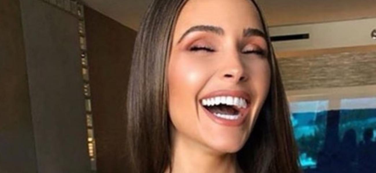 Olivia Culpo Laughs In Her Braless Slip Dress While Getting Ready