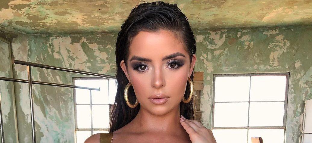 Demi Rose In Her Skin-Baring Green Dress Pops Her Colossal Chest Out