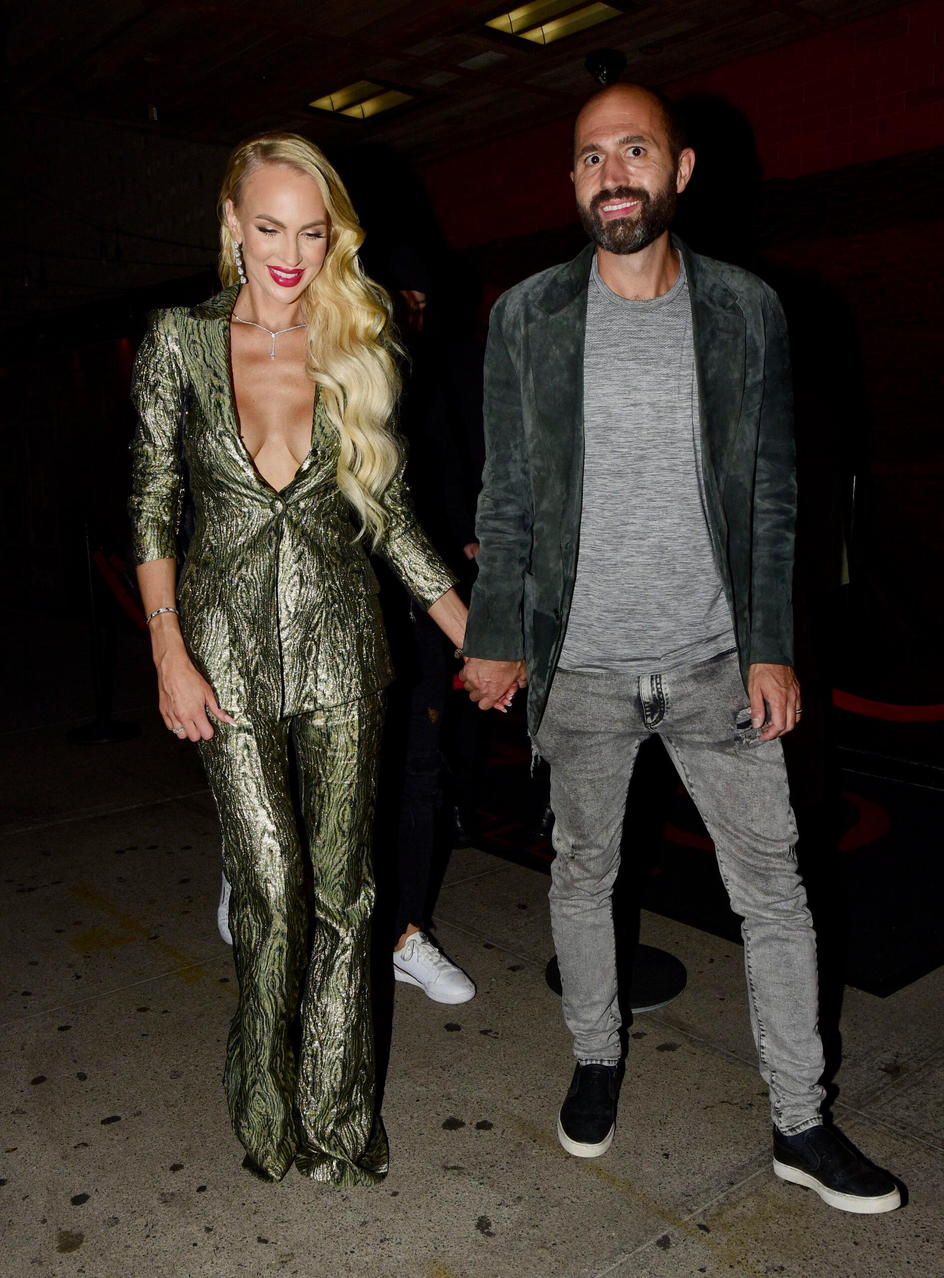  leave the TAO afterparty with husband Christian during fashion week NYC