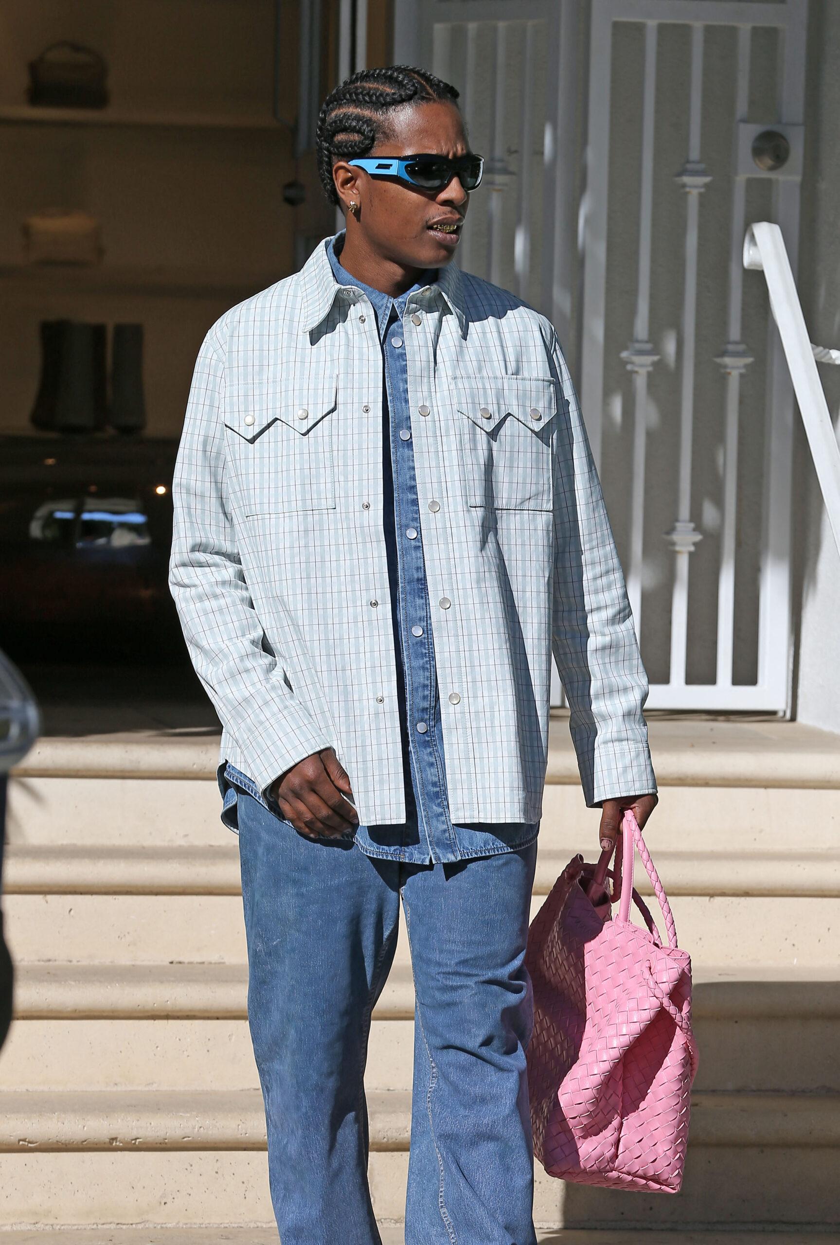 A$AP Rocky is seen leaving bótega Bennett in West Hollywood after shopping at the store in his convertible Rolls Royce.
