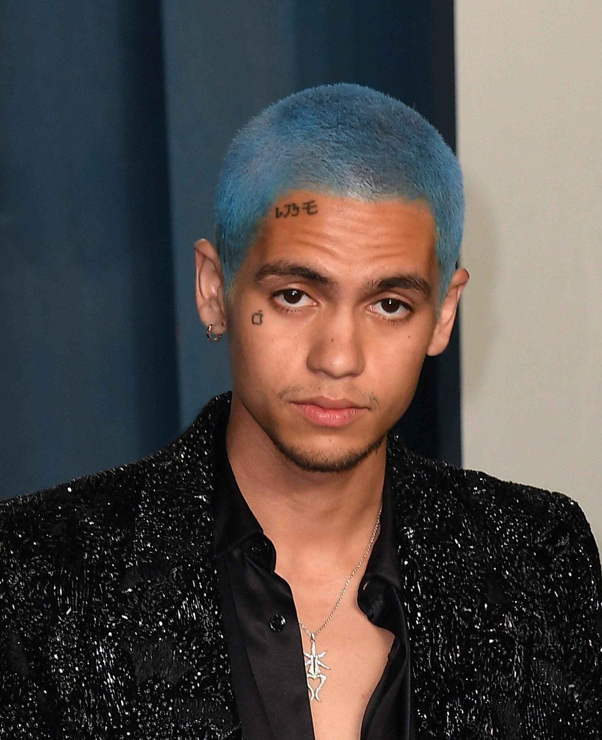 Man with blue hair on red carpet
