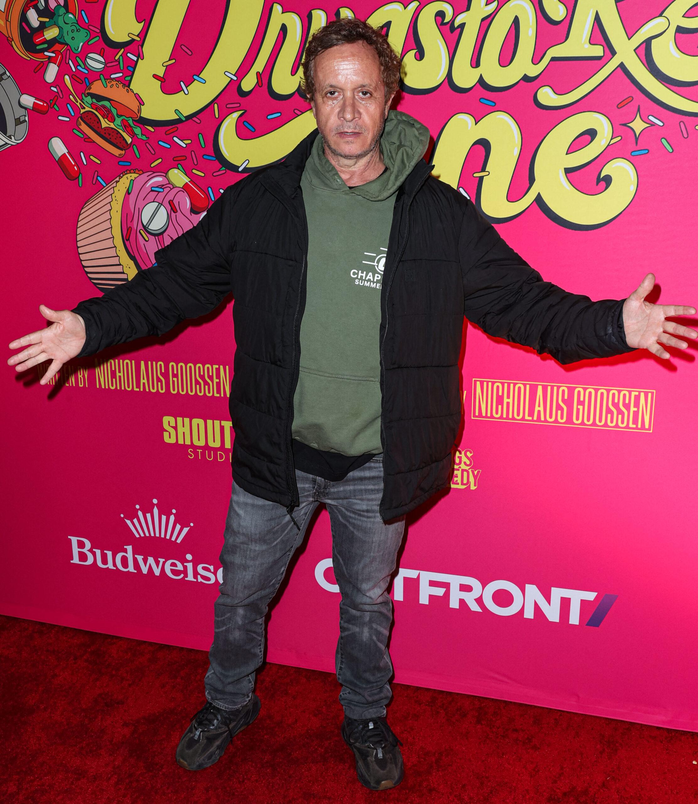 Pauly Shore poses on red carpet at film premiere.
