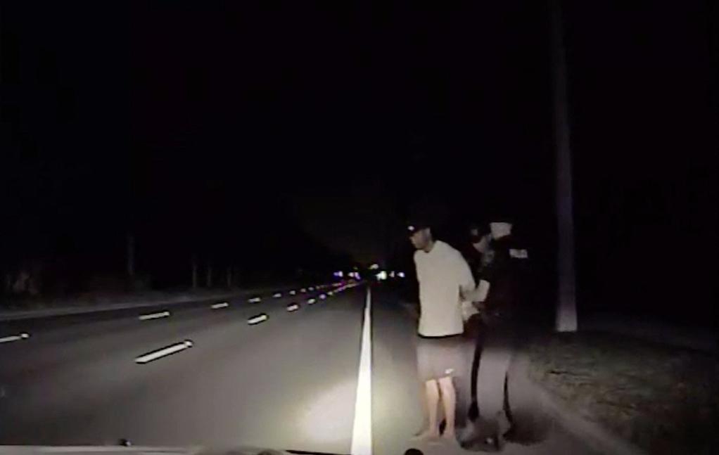 Tiger Woods cuffed and arrested -- stills from dash cam footage of DUI arrest