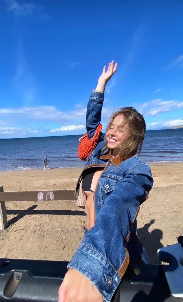 Sydney Sweeney poses for the camera while at the beach.