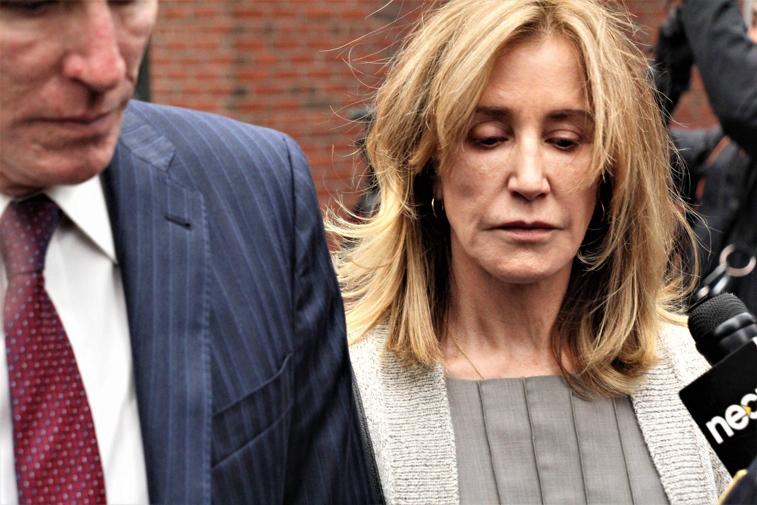Felicity Huffman leaves court.