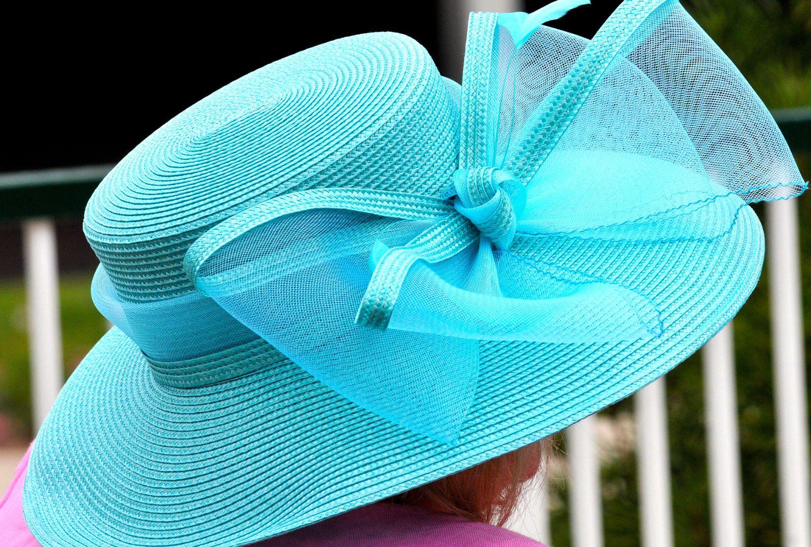 Woman Wearing Blue Derby Hat