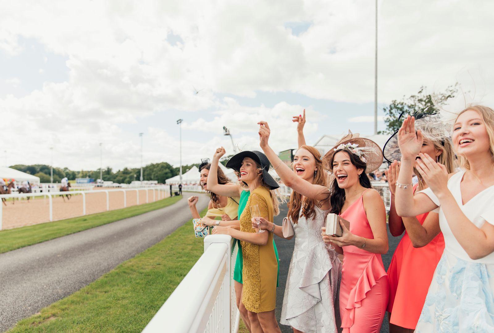 Crowd Cheering On Horses At The Derby