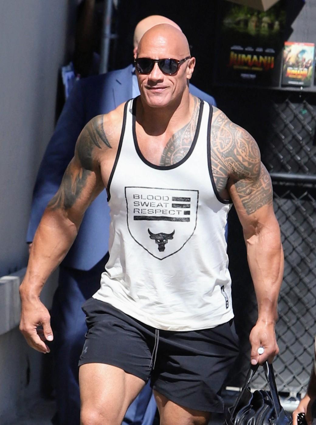 Dwyane Johnson AKA The Rock is seen arriving with his big guns show to Jimmy Kimmel. 20 Jul 2022 Pictured: Dwayne Johnson. Photo credit: APEX / MEGA TheMegaAgency.com +1 888 505 6342 (Mega Agency TagID: MEGA879832_001.jpg) [Photo via Mega Agency]