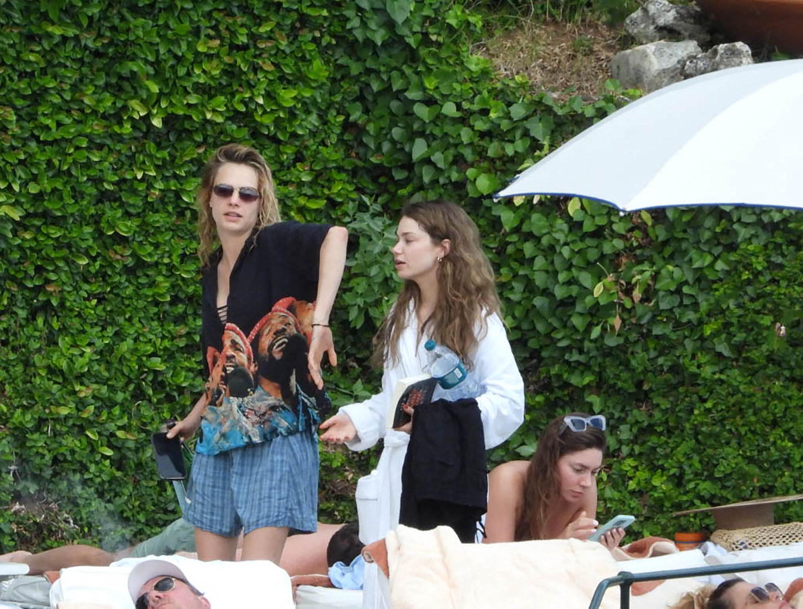 Cara Delevingne seen reaching to hold hands with girlfriend singer Minke in the park of Hotel Splendido in Portofino