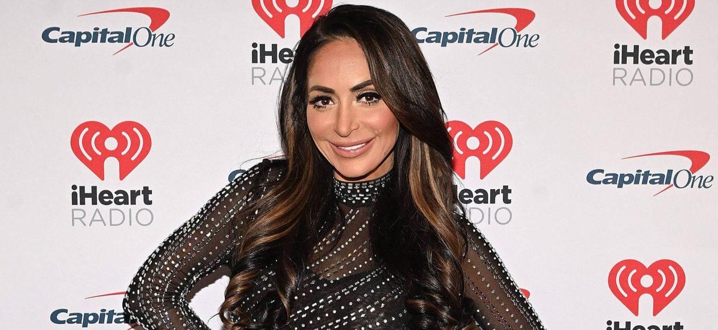 Angelina Pivarnick poses on the red carpet at iHeartRadio z100's Jingle Ball 2023