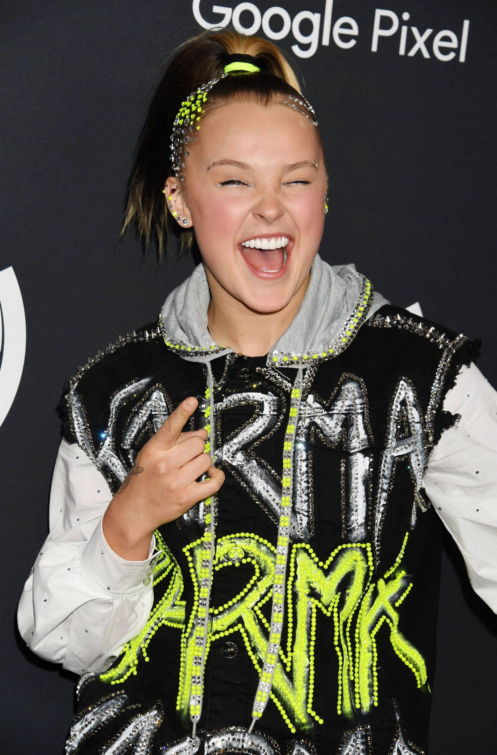 JoJo Siwa wearing a black and gray hoodie