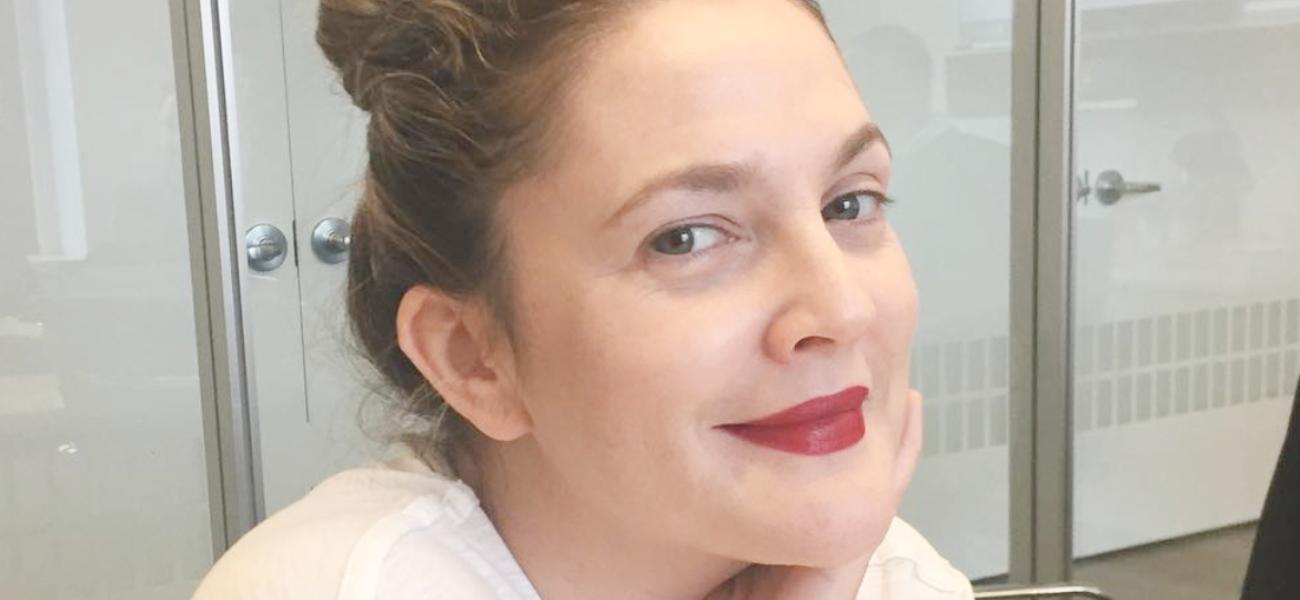 Drew Barrymore smiling indoors