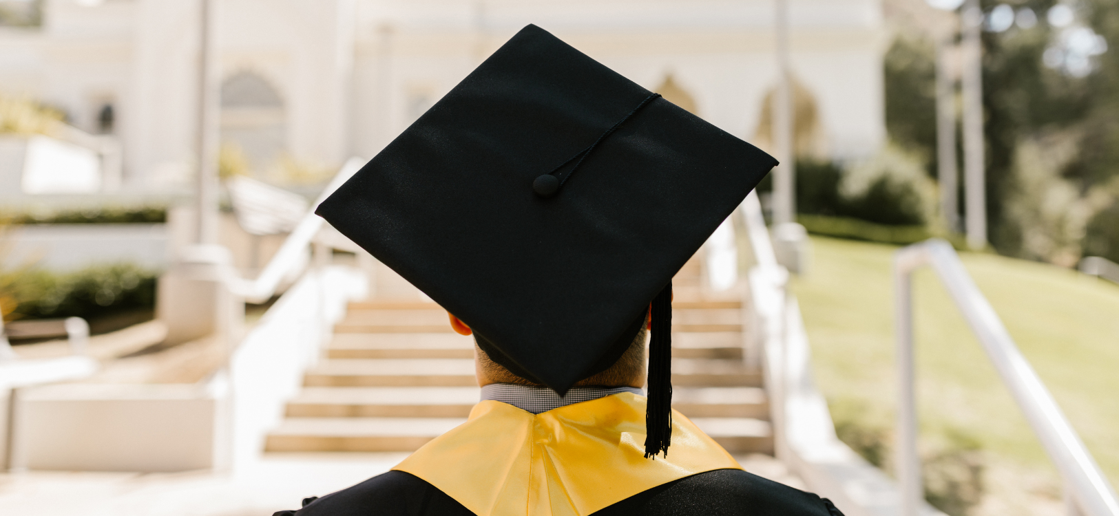 Student wearing graduation cap and gown