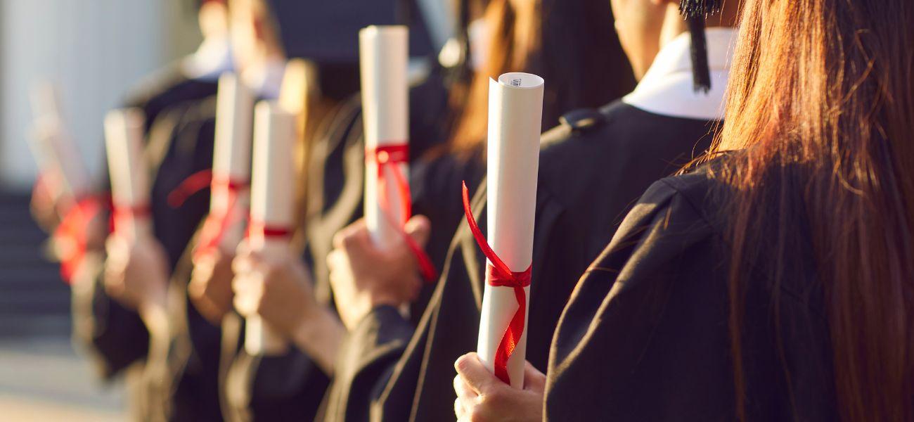 Students holding their diplomas