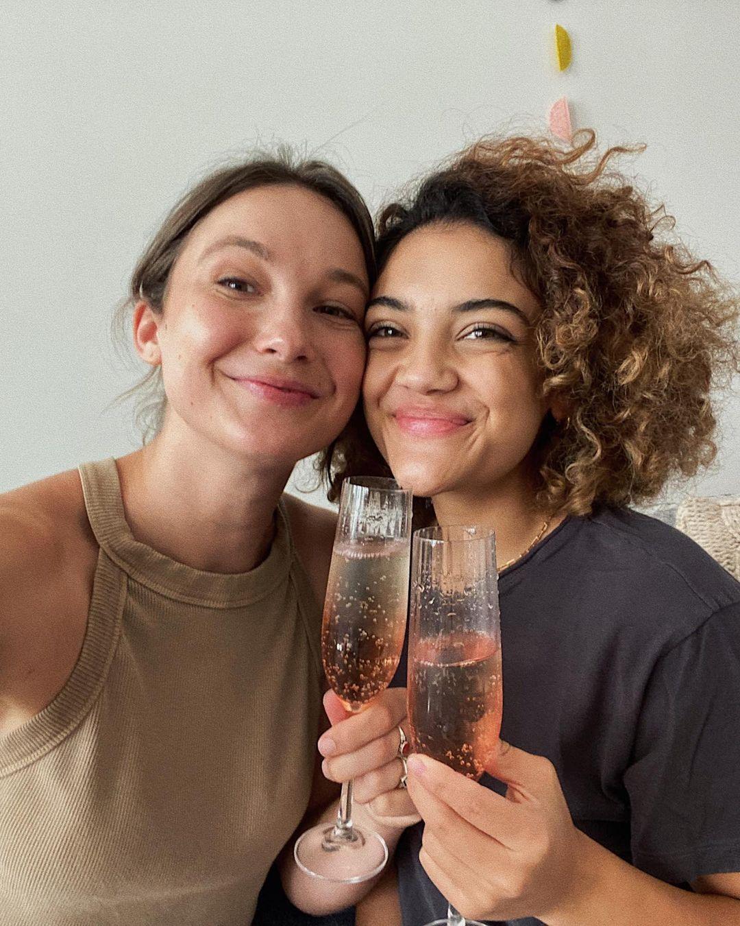 Laurie Hernandez and her partner cheers champagne