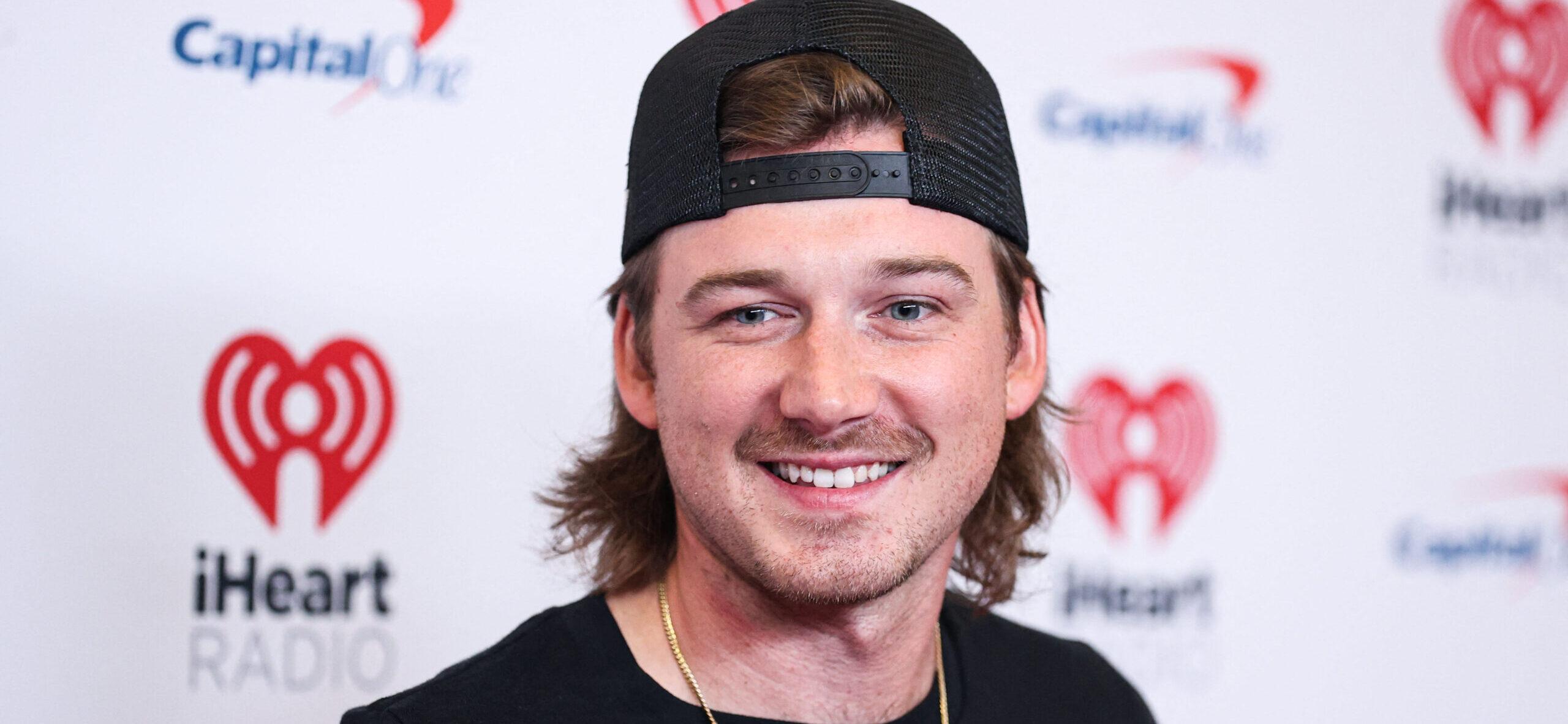 Morgan Wallen wearing a backwards hat