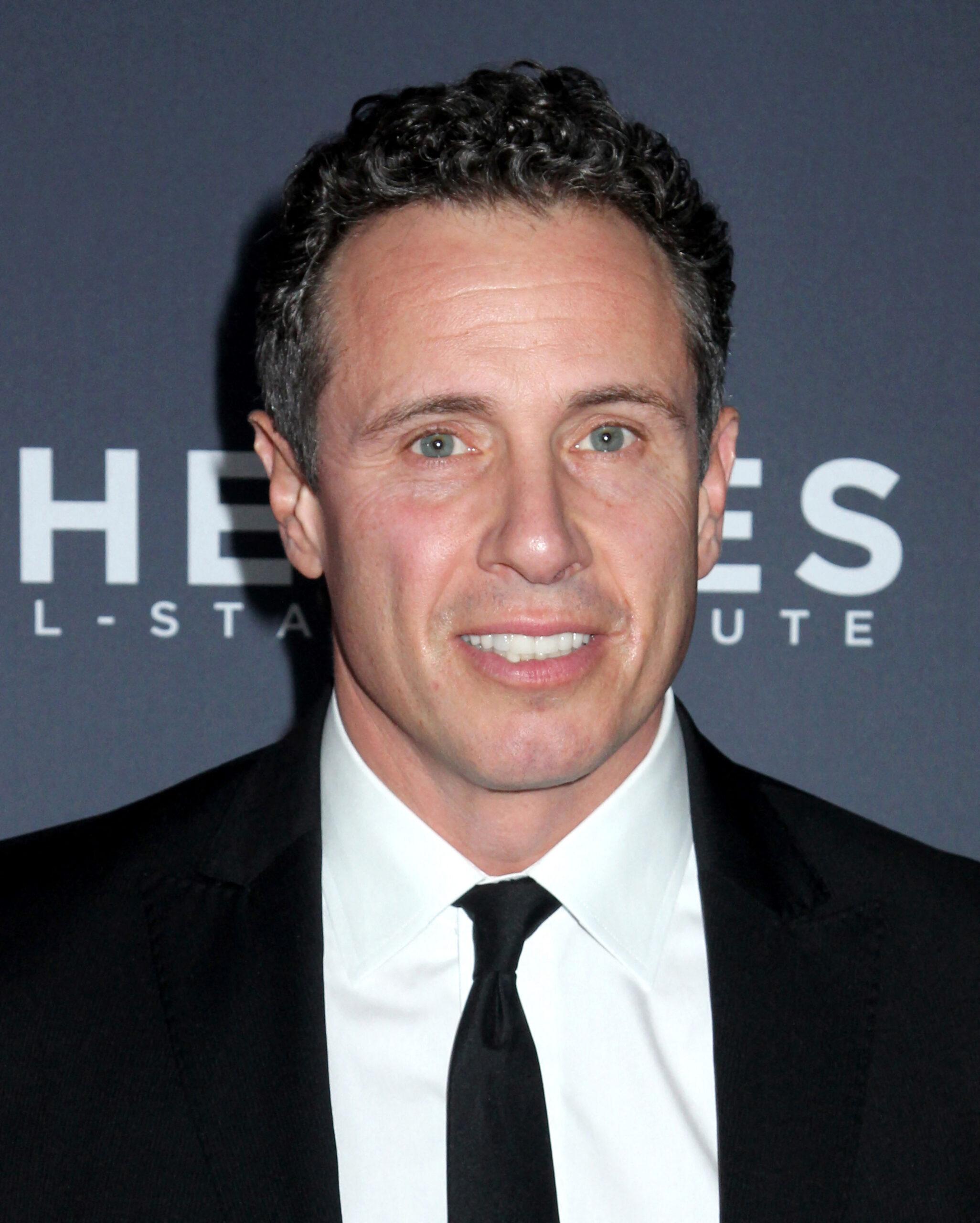 Chris Cuomo smiles in a black tux