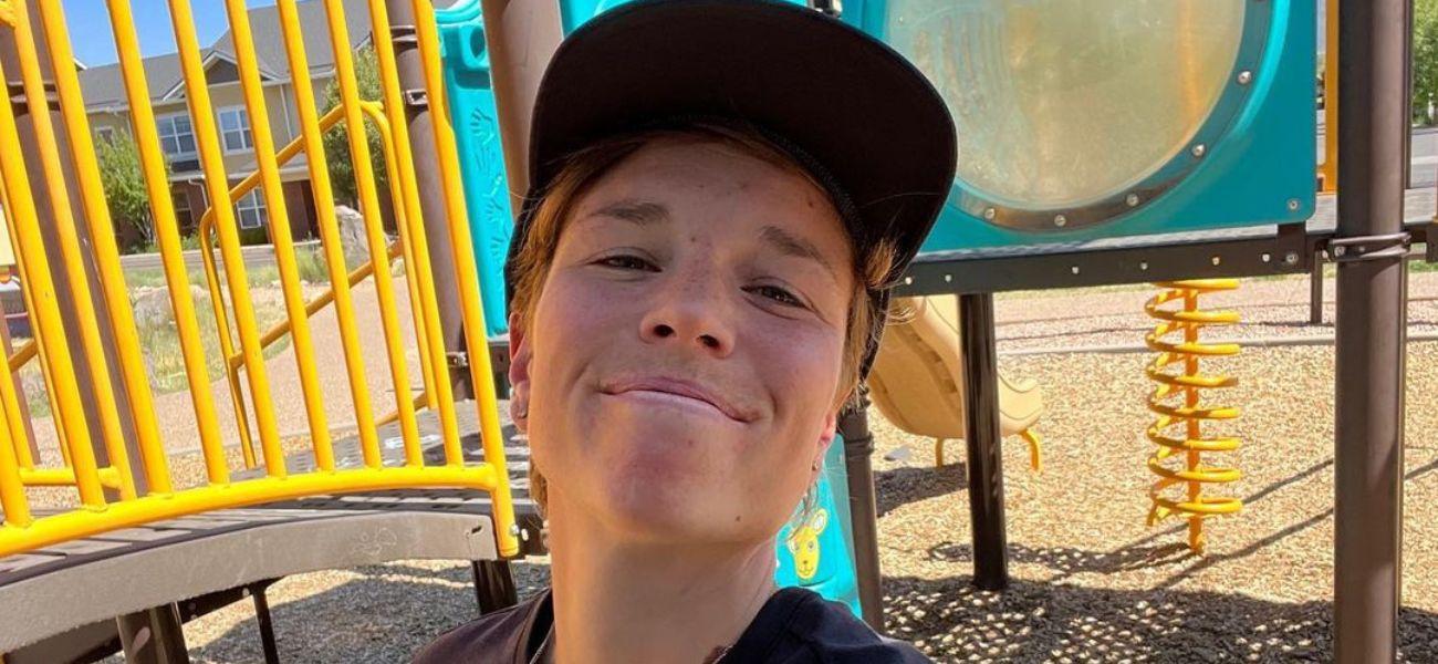 Nikki Hiltz posing on a playground