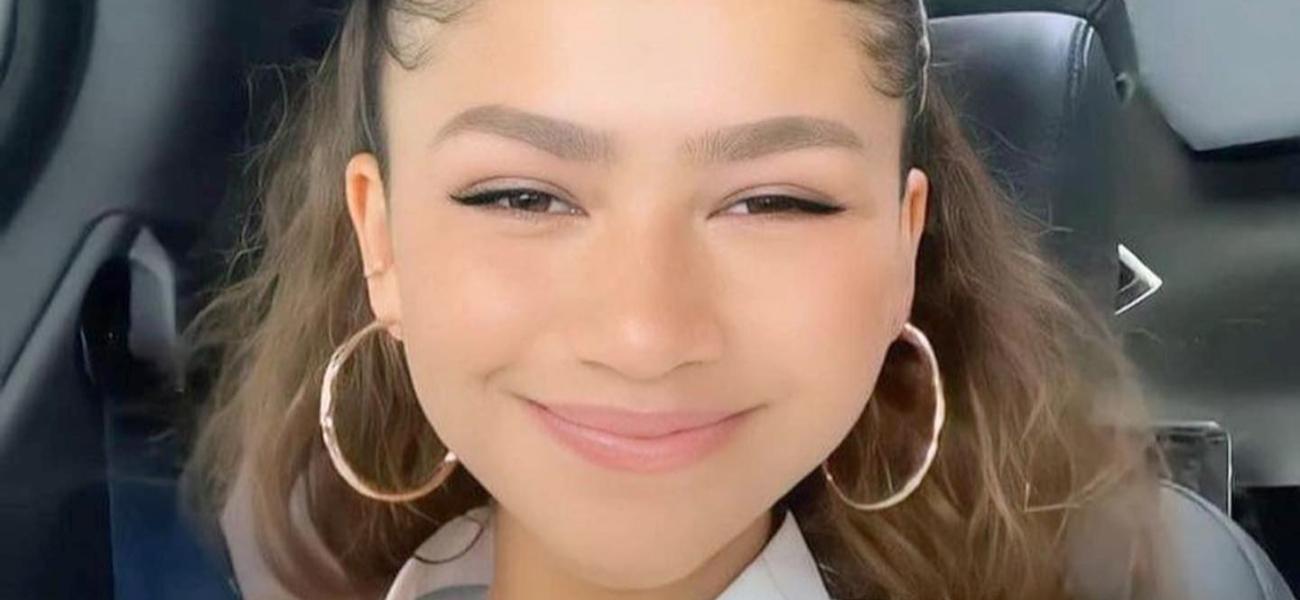 Zendaya smiling from her car