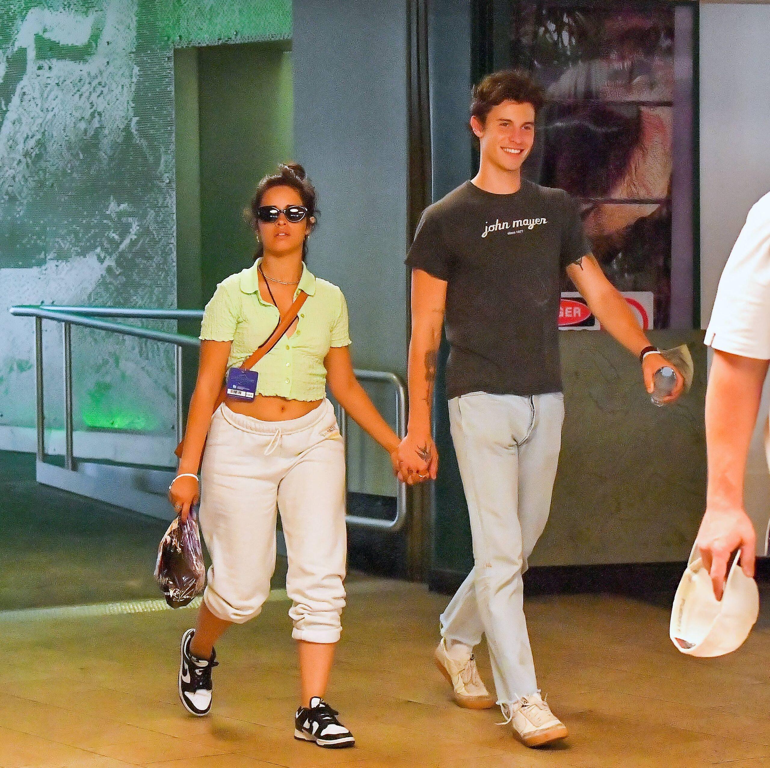 Camila Cabello and Shawn Mendes hold hands as they enjoy a romantic day out at Universal Studios Hollywood