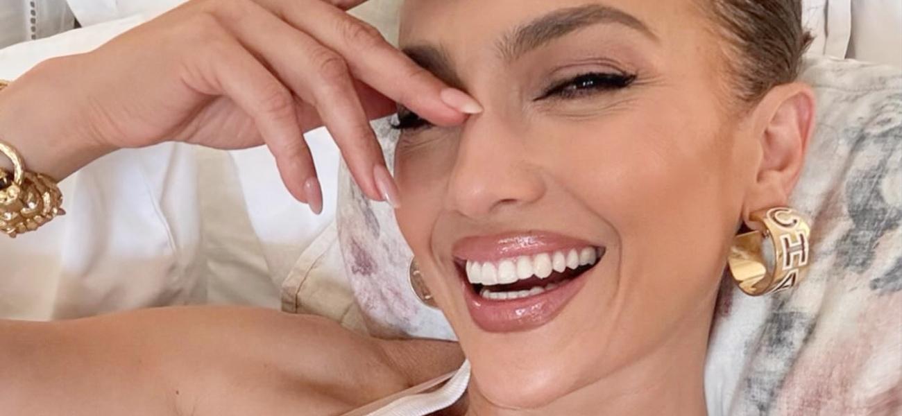Jennifer Lopez poses smiling
