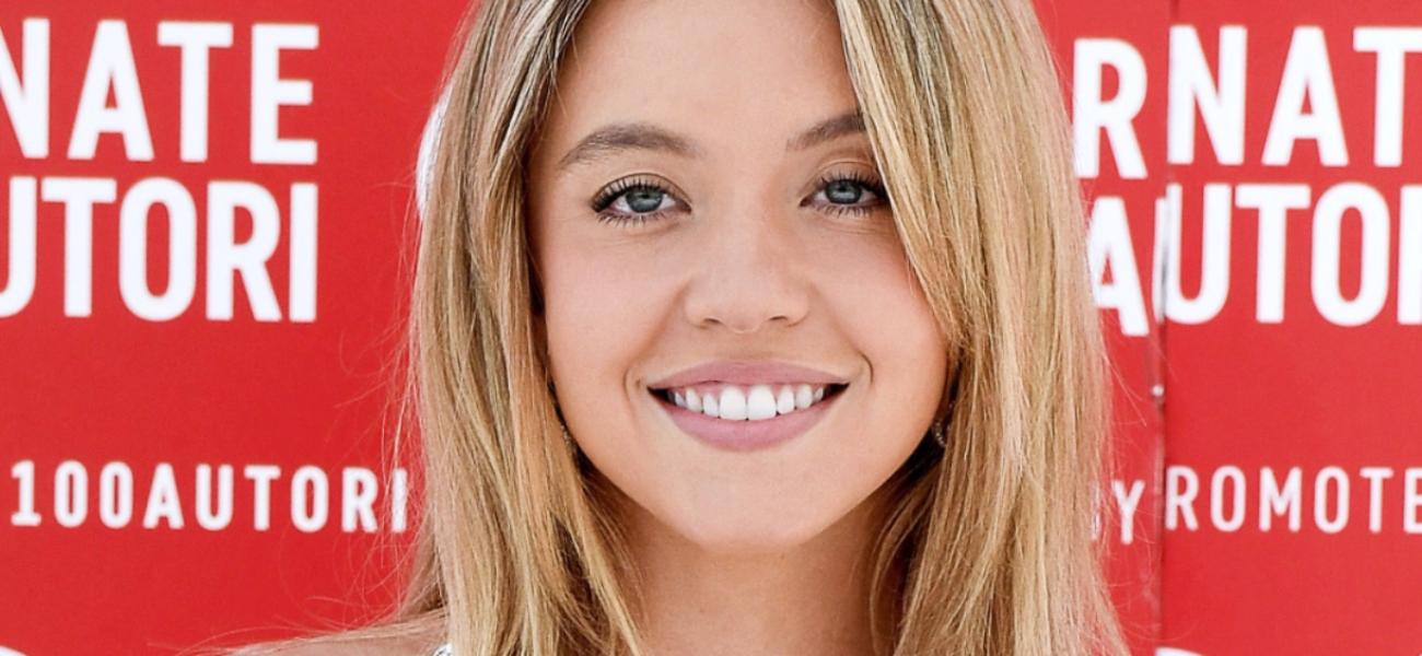 Sydney Sweeney smiling close up