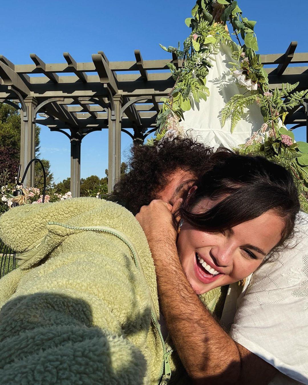 Selena Gomez laughing with Benny Blanco