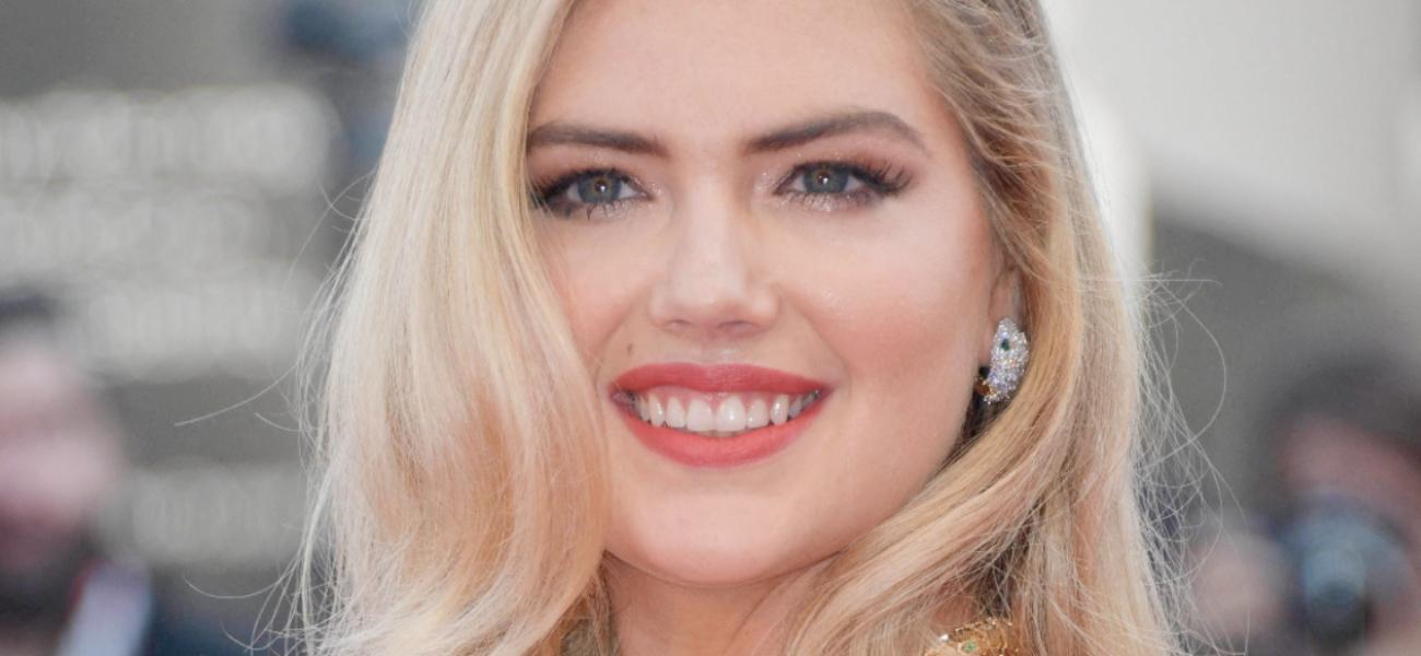 Kate Upton smiles at an event